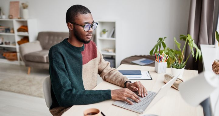 Man sitting and working on computer