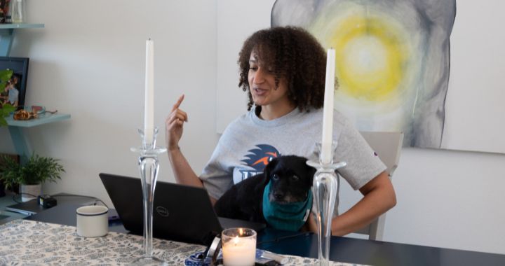 Shalita Myrick gesturing while looking at computer