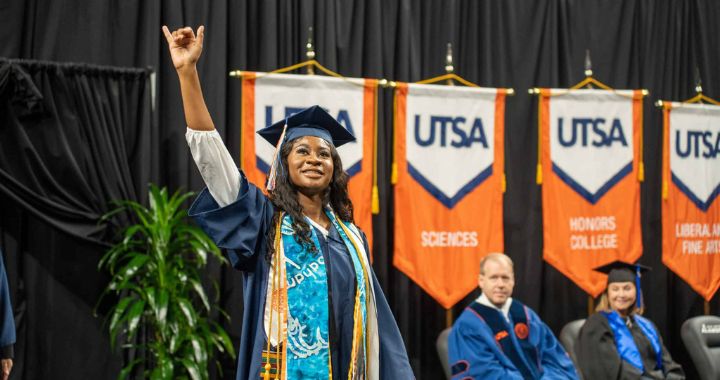 Student crossing the stage at graduation